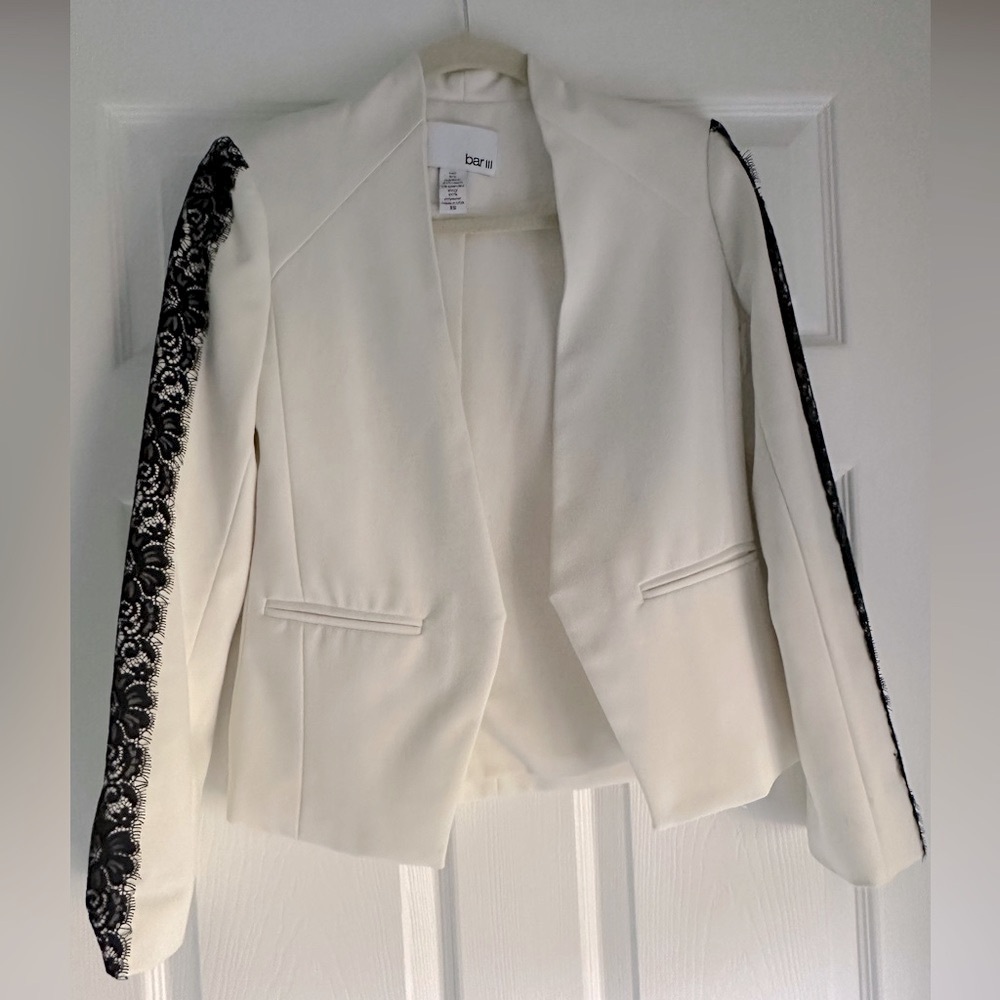 White blazer with lace arm detail